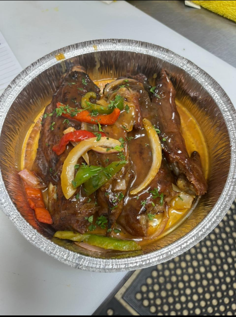 A Group Of Turkey Legs With Spices And Lemon Slices